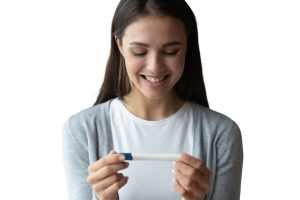 woman looking at a pregnancy test