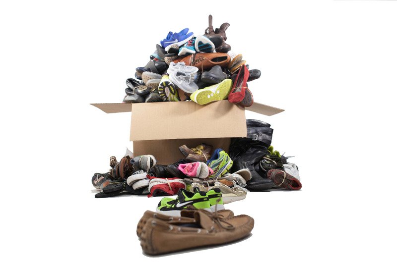 Box overflowing with shoes for shoe drive fundraiser