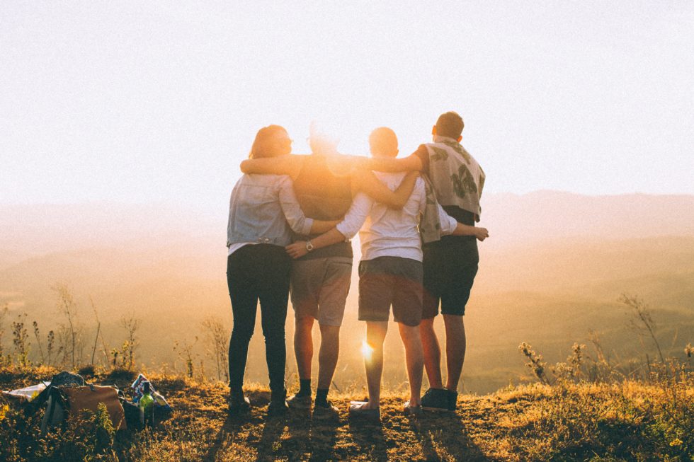 friends looking at sunset