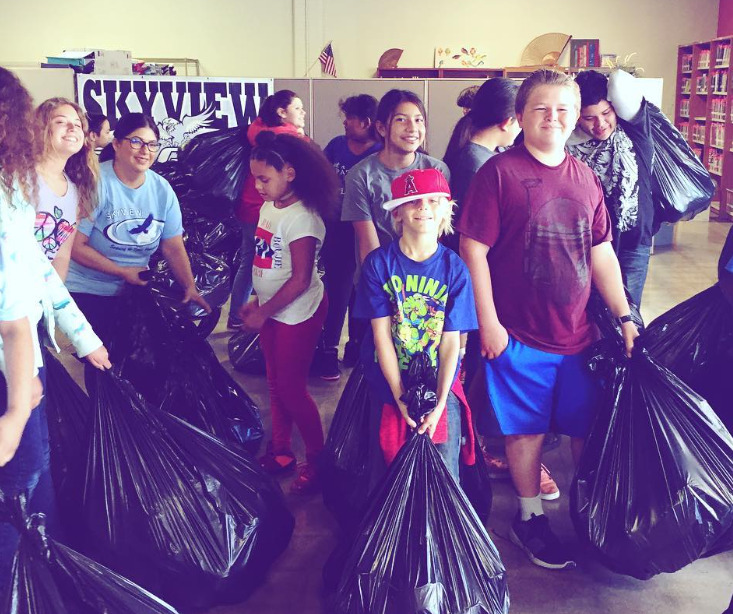 student participating in collecting shoes to raise funds for school fundraiser 