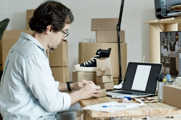 man making promotional materials for fundraiser